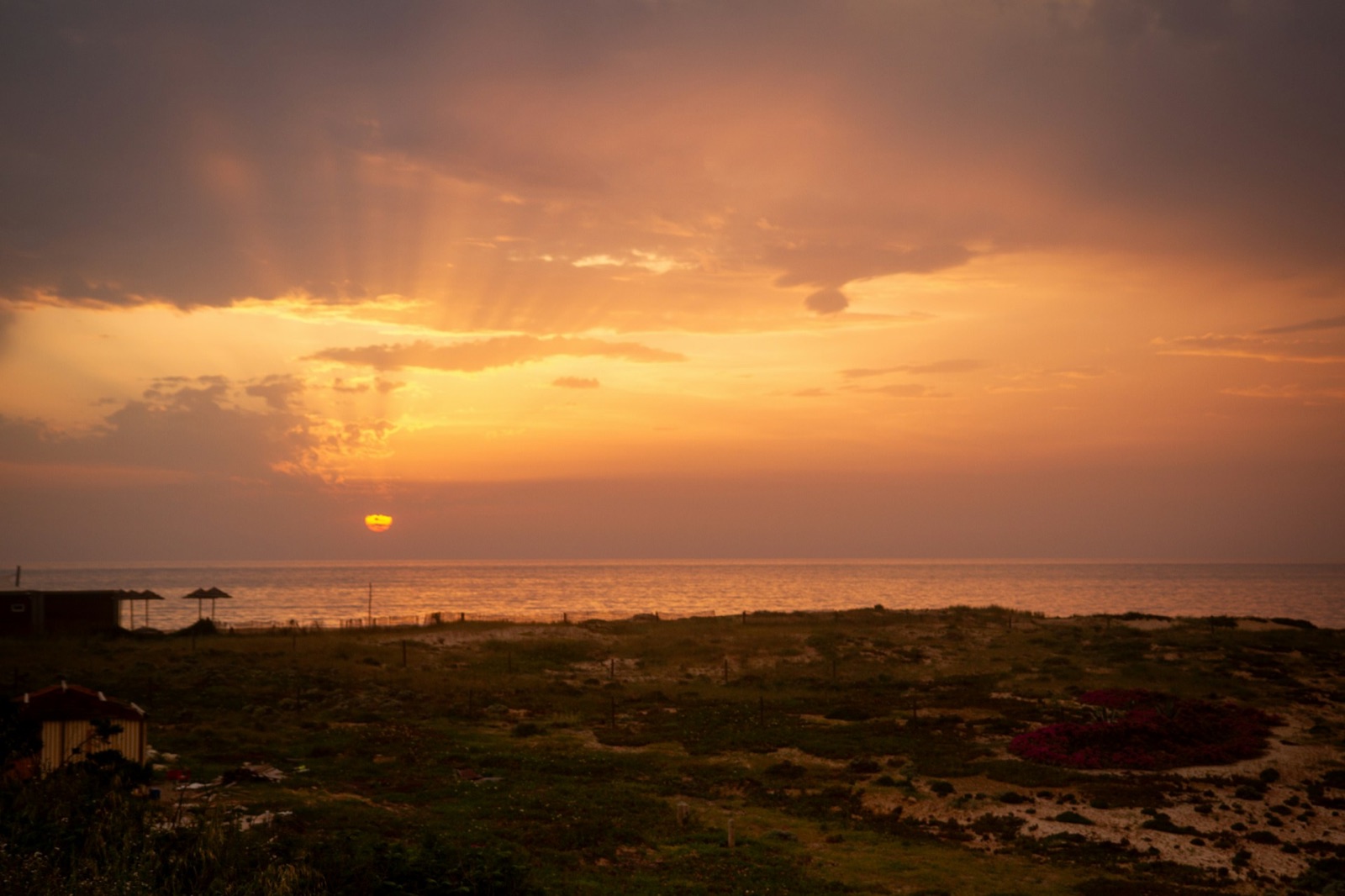 Sunset over dunes and the Atlantic coast at Melides, Portugal.